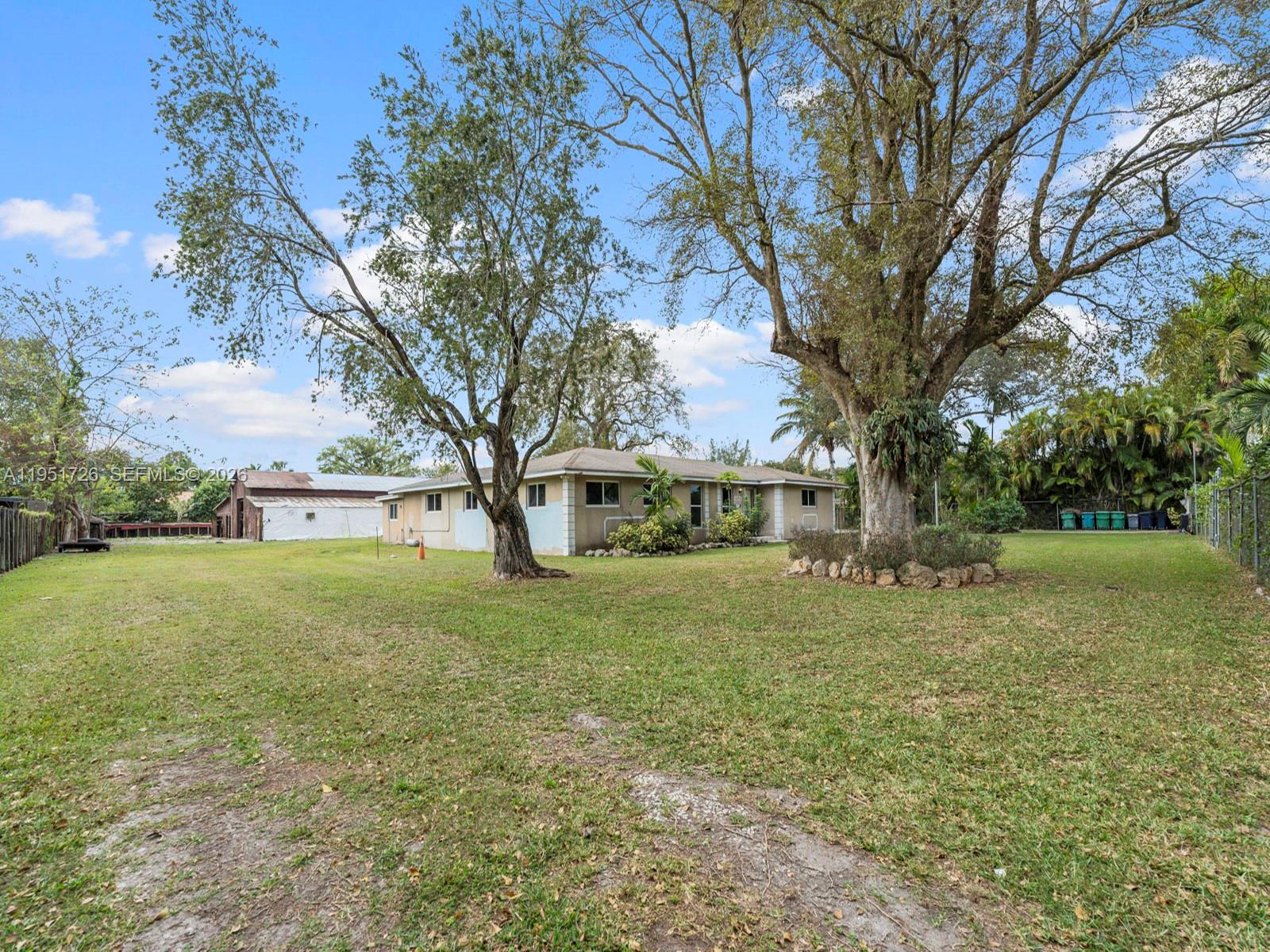 12570 Southwest 45th Street Miami, FL 33175 - Photo 23 of 25 a view of a big yard next to a house