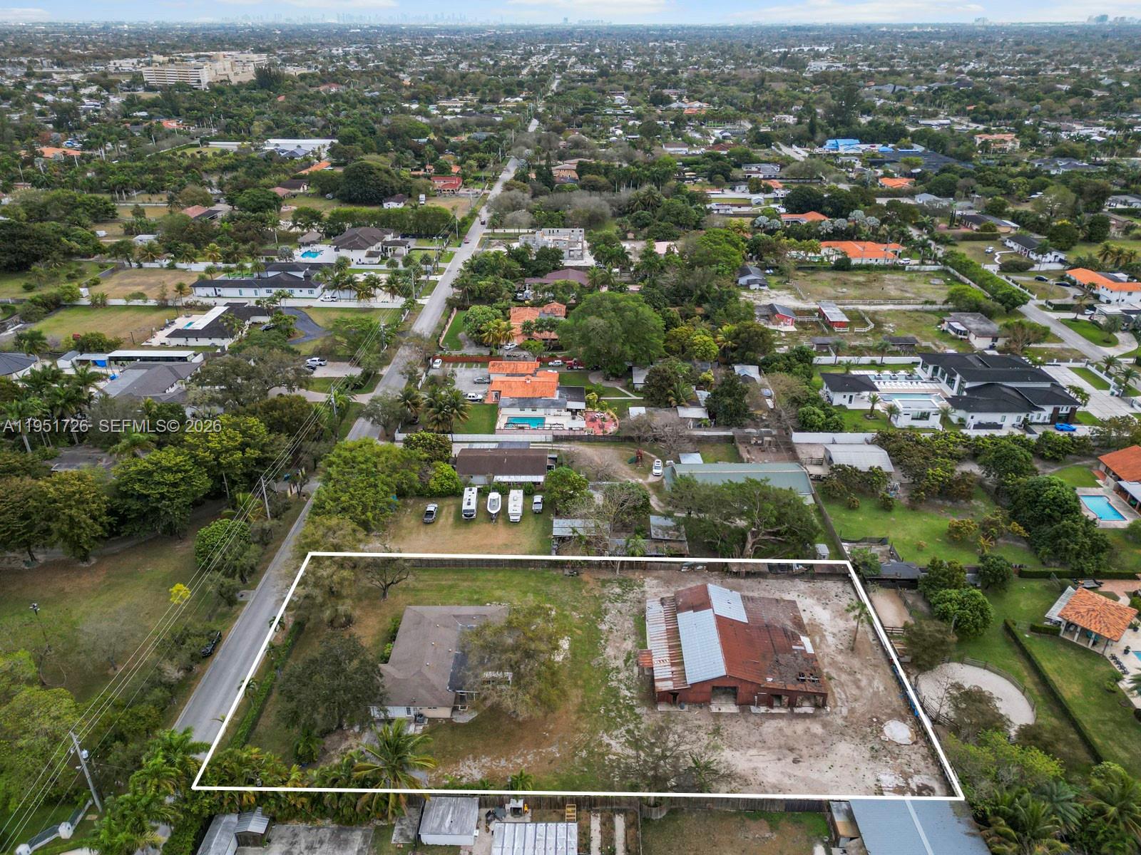 12570 Southwest 45th Street Miami, FL 33175 - Photo 9 of 25 an aerial view of residential houses with outdoor space and lake view