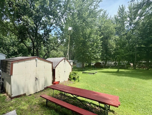 26-235 Woodhaven Sublette, IL 61367 - Photo 5 of 11 a view of a backyard with wooden fence