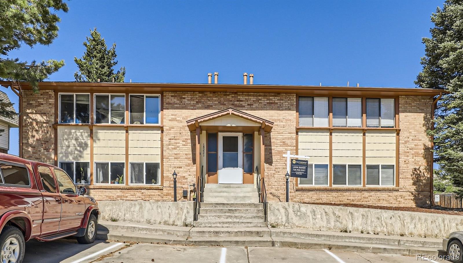 18221 West 3rd Place Golden, CO 80401 - Photo 1 of 12 a front view of a house with a yard