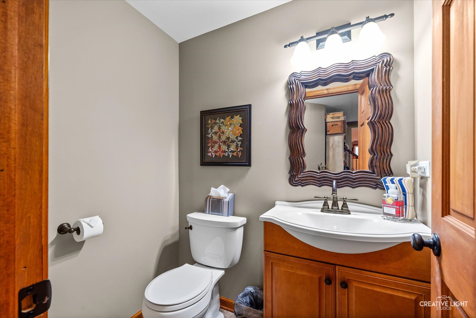 2828 Miller Road Geneva, IL 60134 - Photo 30 of 40 a bathroom with a sink vanity mirror and toilet