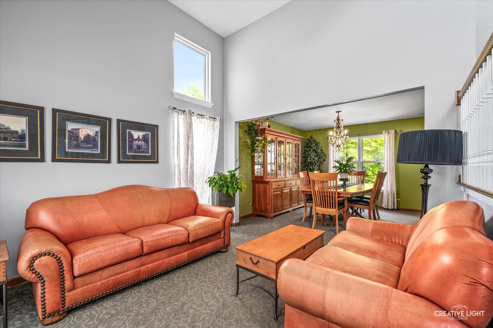2828 Miller Road Geneva, IL 60134 - Photo 5 of 40 a living room with furniture a lamp and a large window