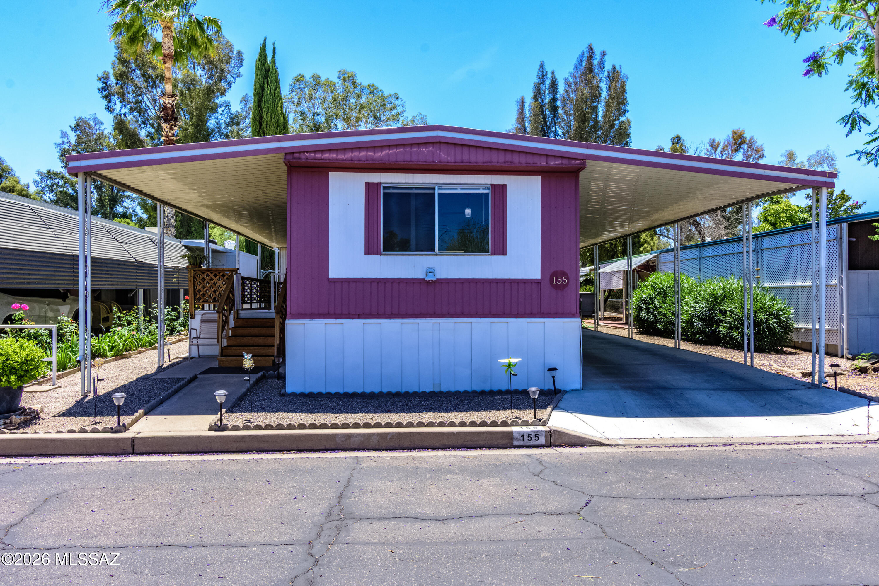 4550 North Flowing Wells Road, Unit 155 Tucson, AZ 85705 - Photo 3 of 40 a view of a house with a yard
