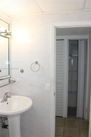 a bathroom with a shower and a sink