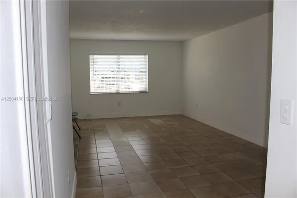 a view of an empty room and window