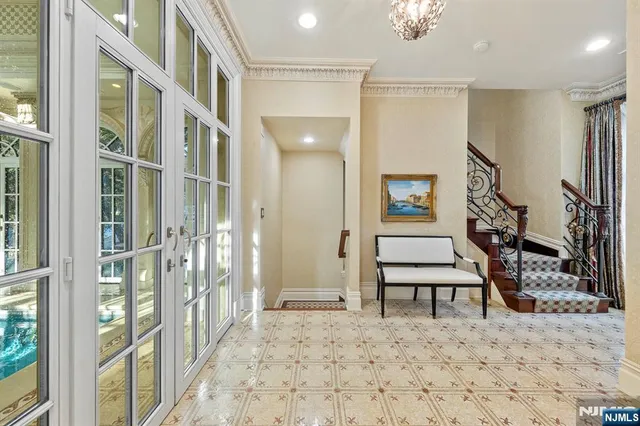 a view of a hallway with wooden floor and entryway