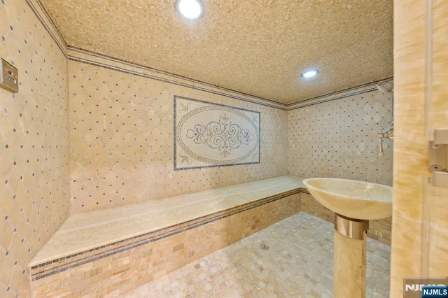 a bathroom with a bathtub and shower