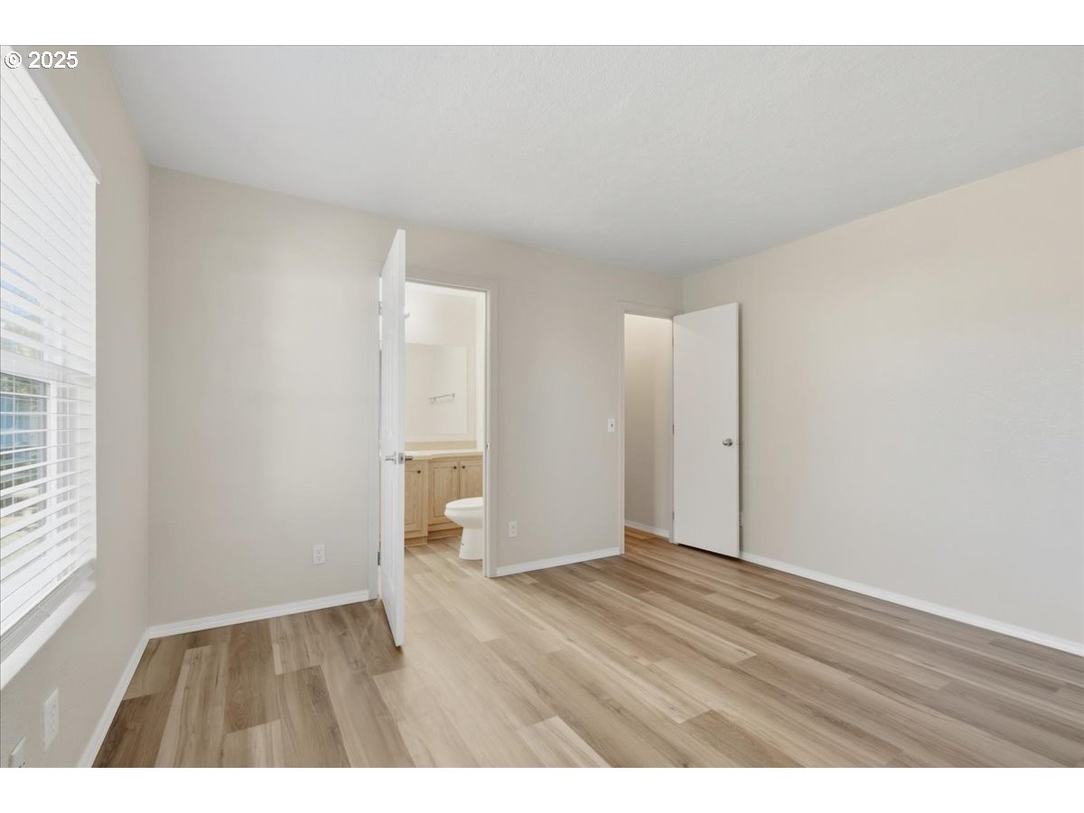 300 Southwest 7th Avenue, Unit 901 Battle Ground, WA 98604 - Photo 11 of 31 a view of an empty room with wooden floor