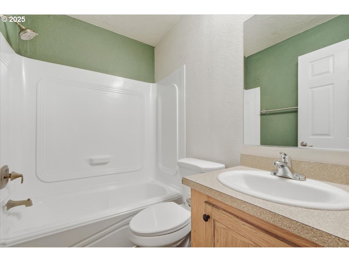 300 Southwest 7th Avenue, Unit 901 Battle Ground, WA 98604 - Photo 18 of 31 a bathroom with a sink toilet and shower