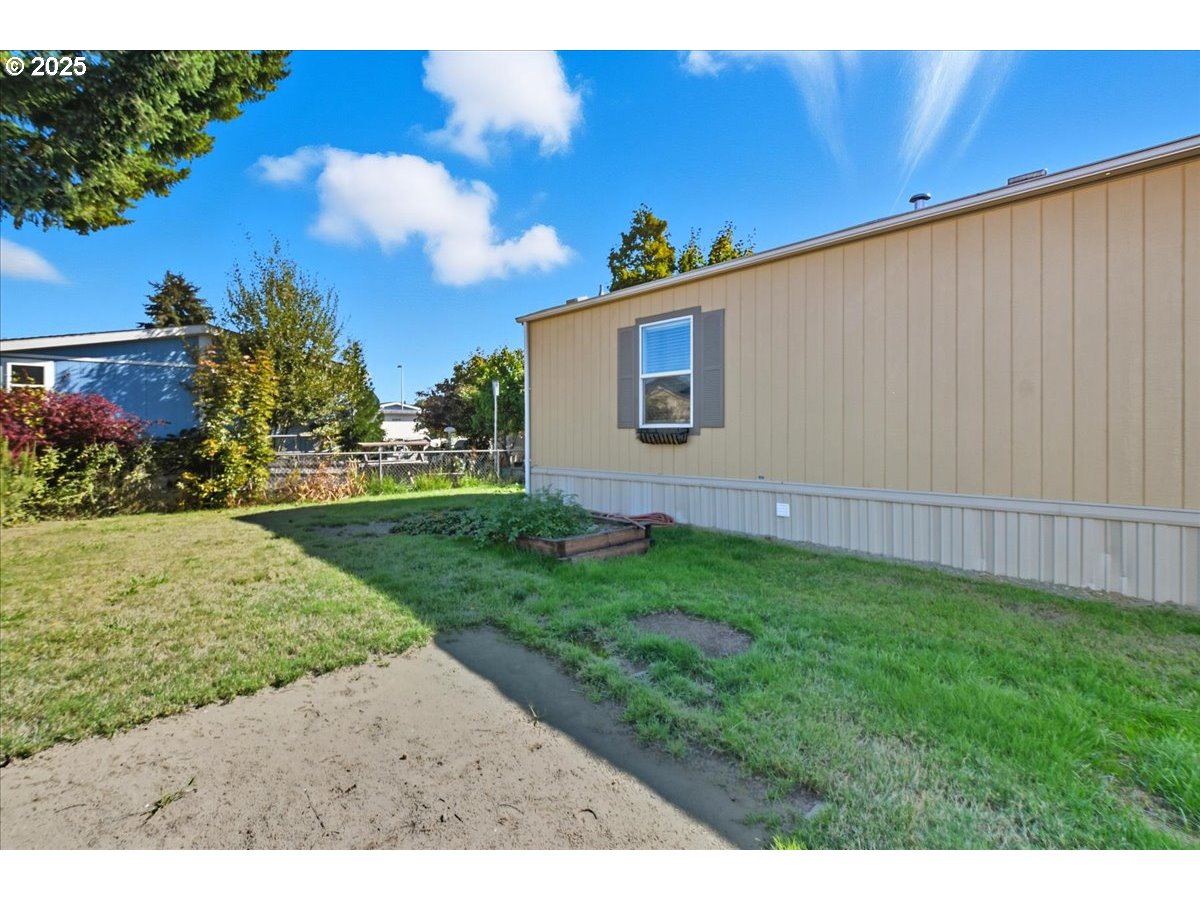 300 Southwest 7th Avenue, Unit 901 Battle Ground, WA 98604 - Photo 20 of 31 a view of a backyard with plants and trees