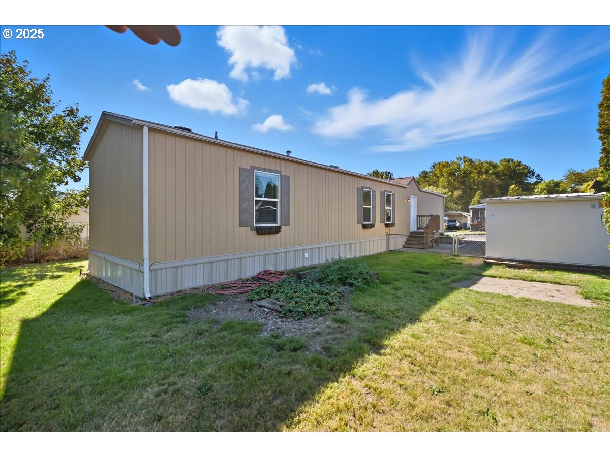 300 Southwest 7th Avenue, Unit 901 Battle Ground, WA 98604 - Photo 21 of 31 a view of an house with backyard space and garden