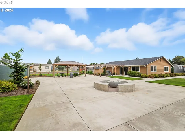 a view of a yard with potted plants