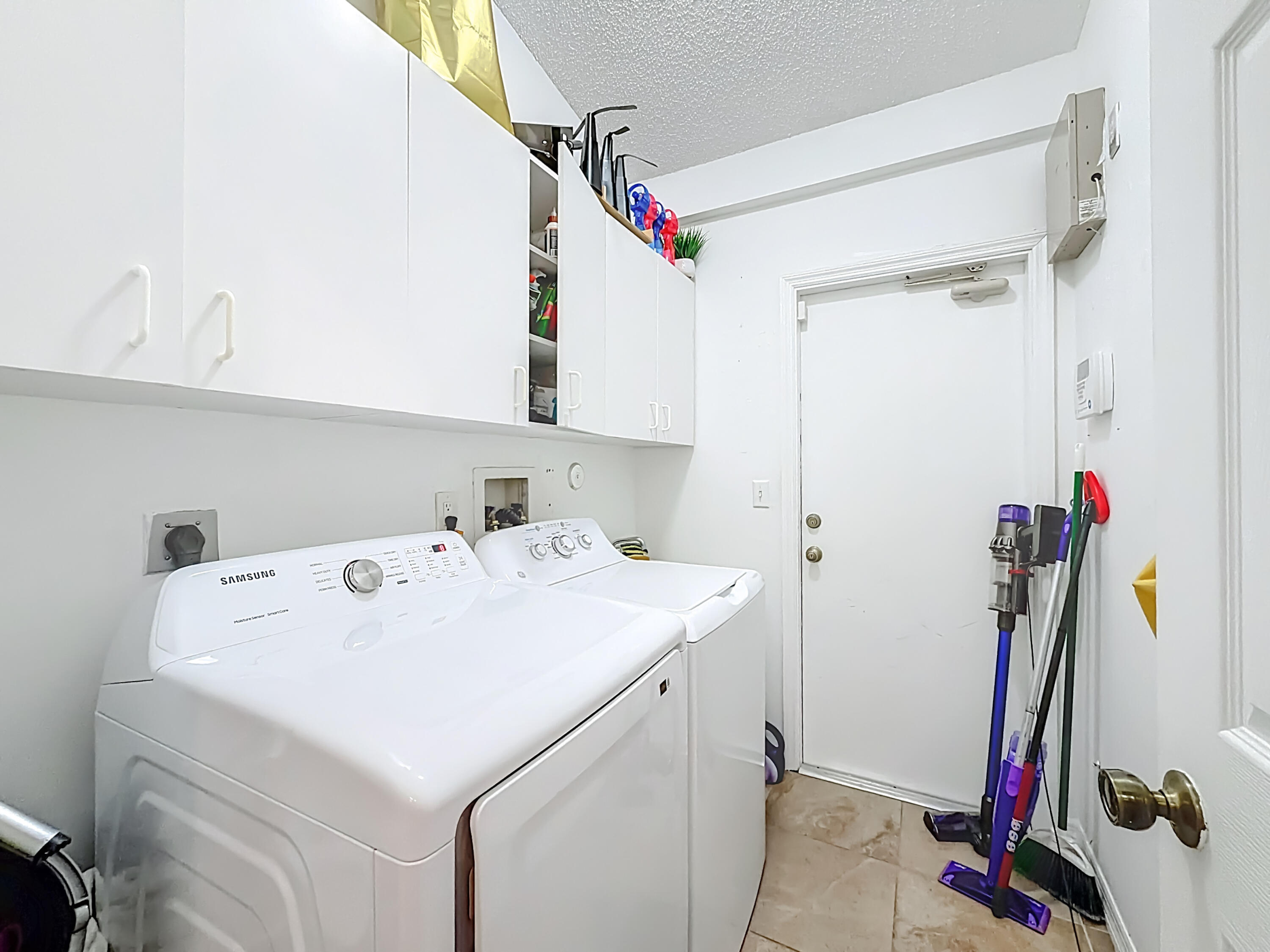 450 Northwest 53rd Street Boca Raton, FL 33487 - Photo 24 of 52 a utility room with dryer and washer