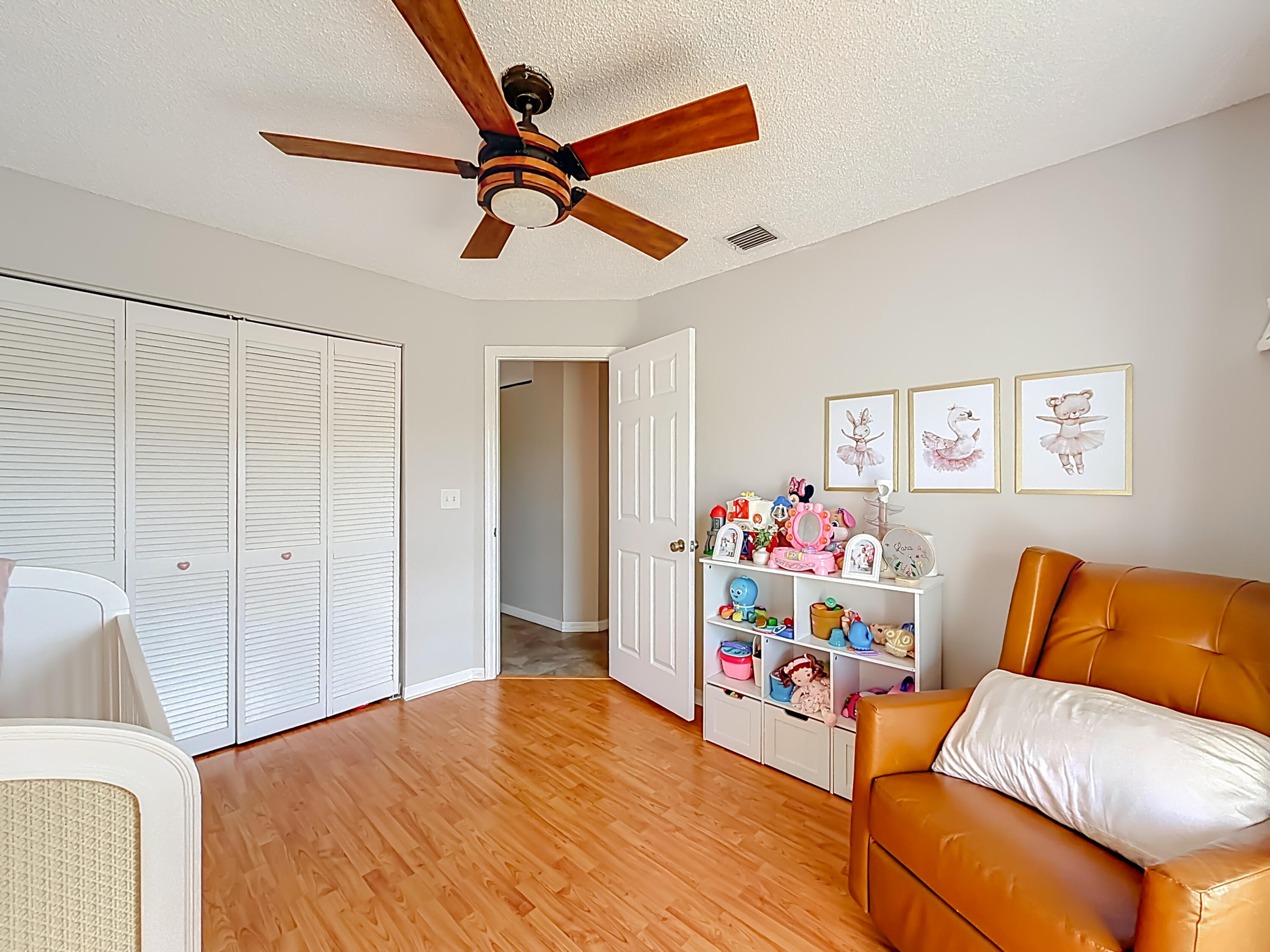 450 Northwest 53rd Street Boca Raton, FL 33487 - Photo 33 of 52 a bedroom with furniture and a wooden floor