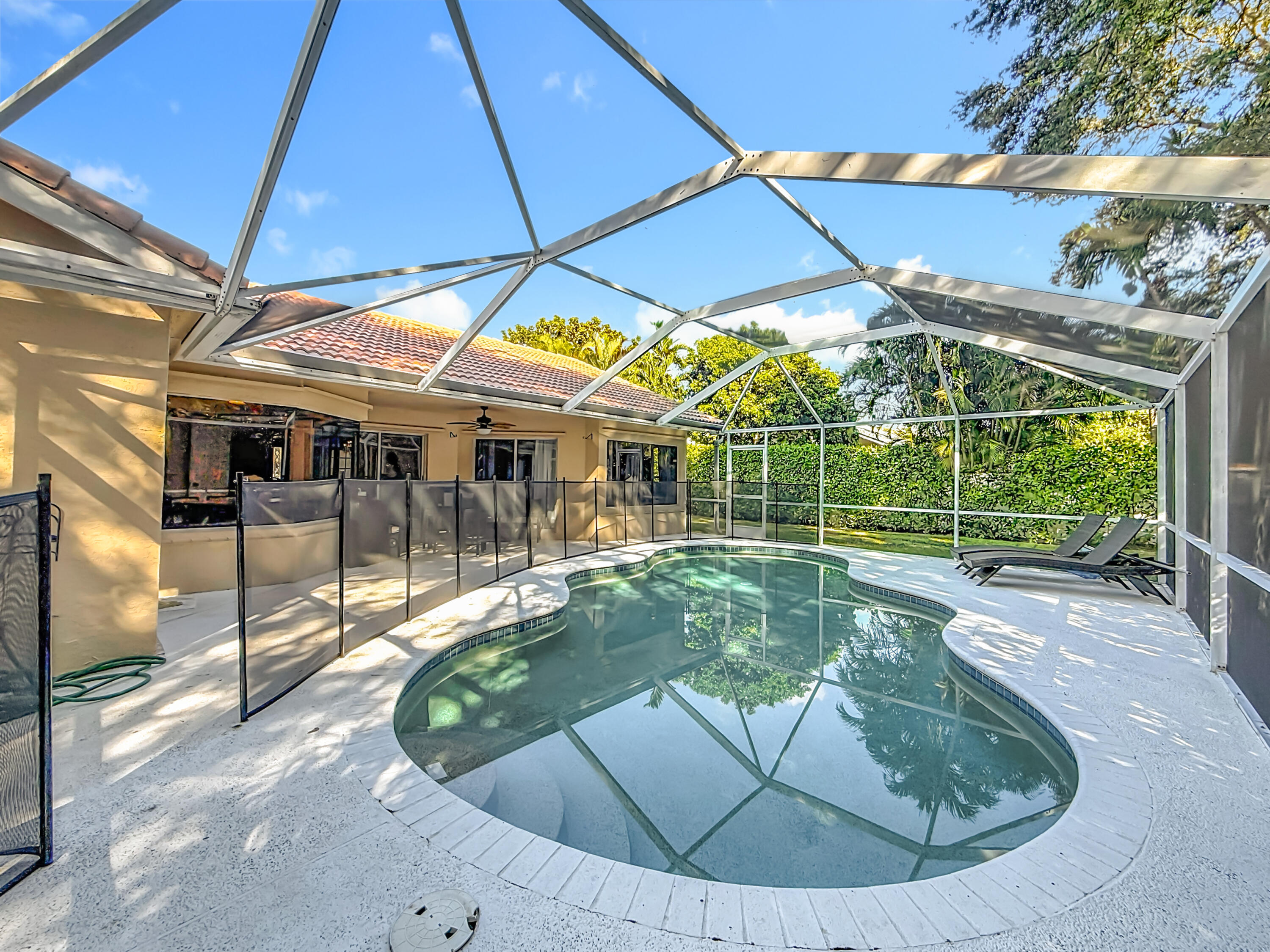 450 Northwest 53rd Street Boca Raton, FL 33487 - Photo 37 of 52 a view of a house with backyard porch and sitting area