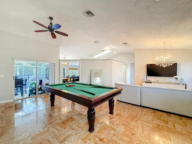 a kitchen with stainless steel appliances granite countertop a stove top oven a sink dishwasher and a refrigerator