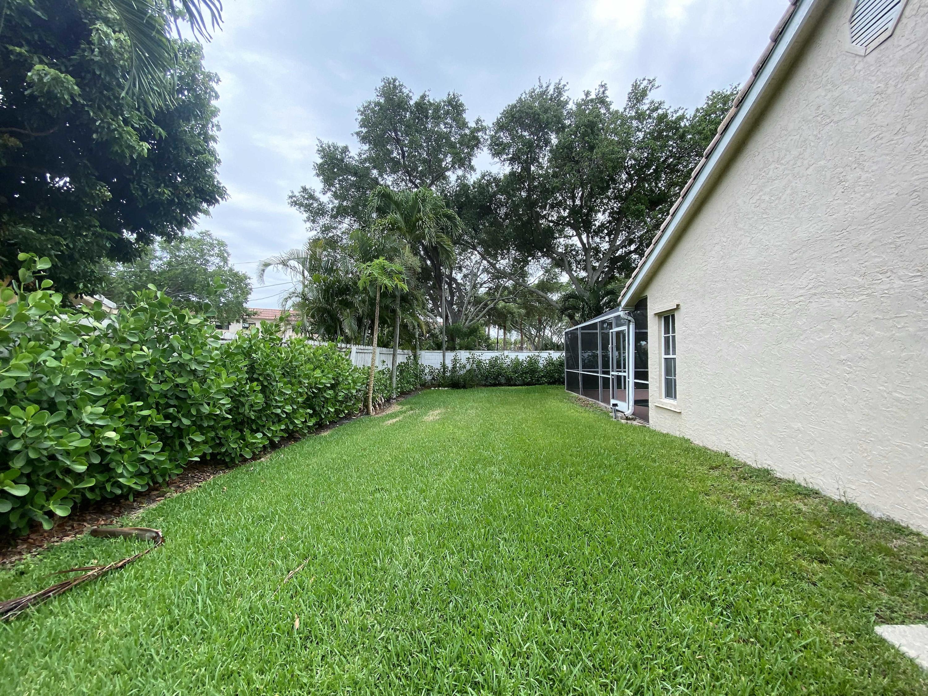 450 Northwest 53rd Street Boca Raton, FL 33487 - Photo 41 of 52 a view of a backyard with a garden