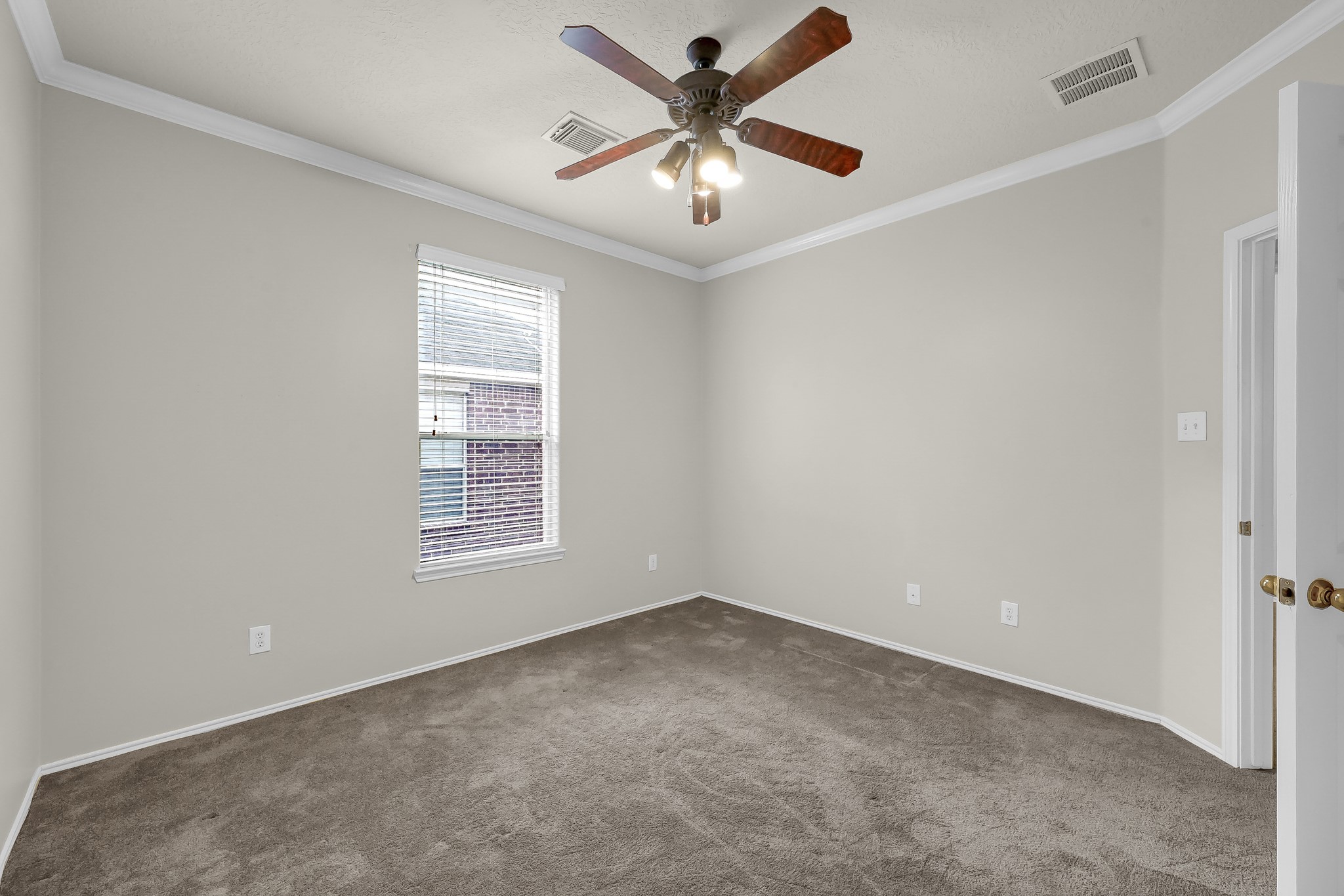 951 Crannog Way Conroe, TX 77301 - Photo 31 of 44 a view of an empty room with a window