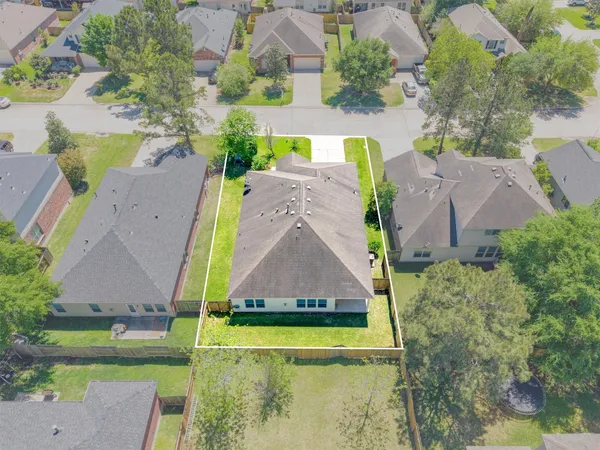an aerial view of a house with garden