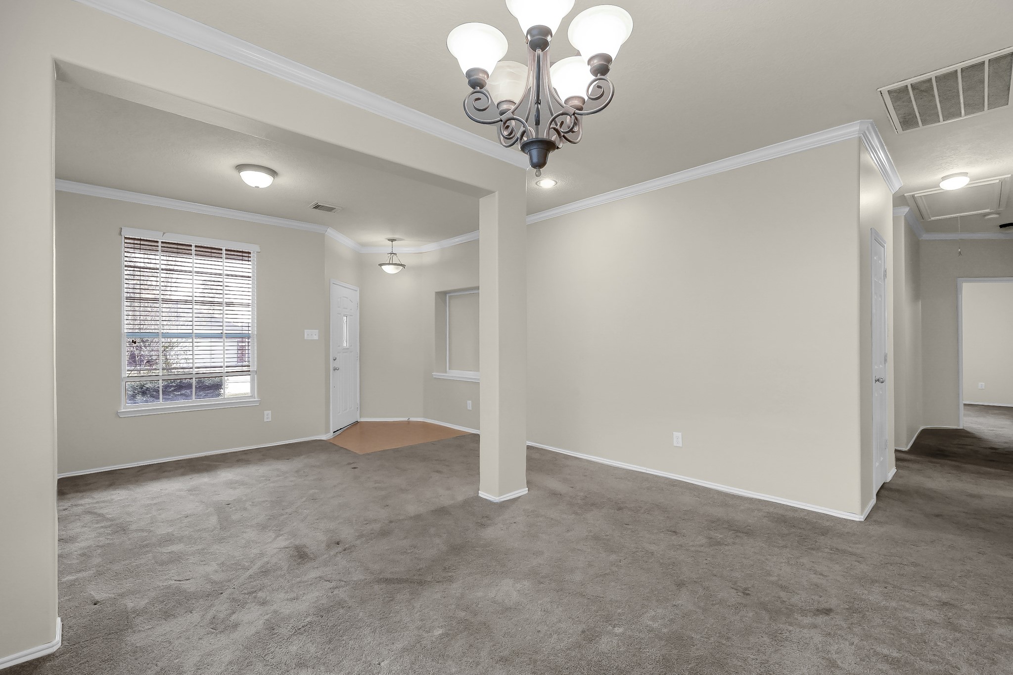 951 Crannog Way Conroe, TX 77301 - Photo 8 of 44 a view of an empty room with a window