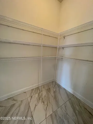 a view of a room with racks on the wall