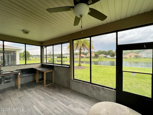a view of a room with a large window