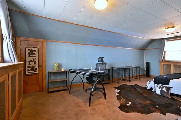 a workspace with furniture and a window