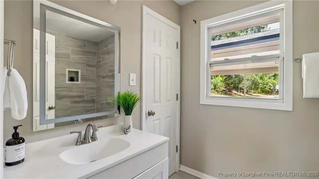 a bathroom with a sink and a mirror