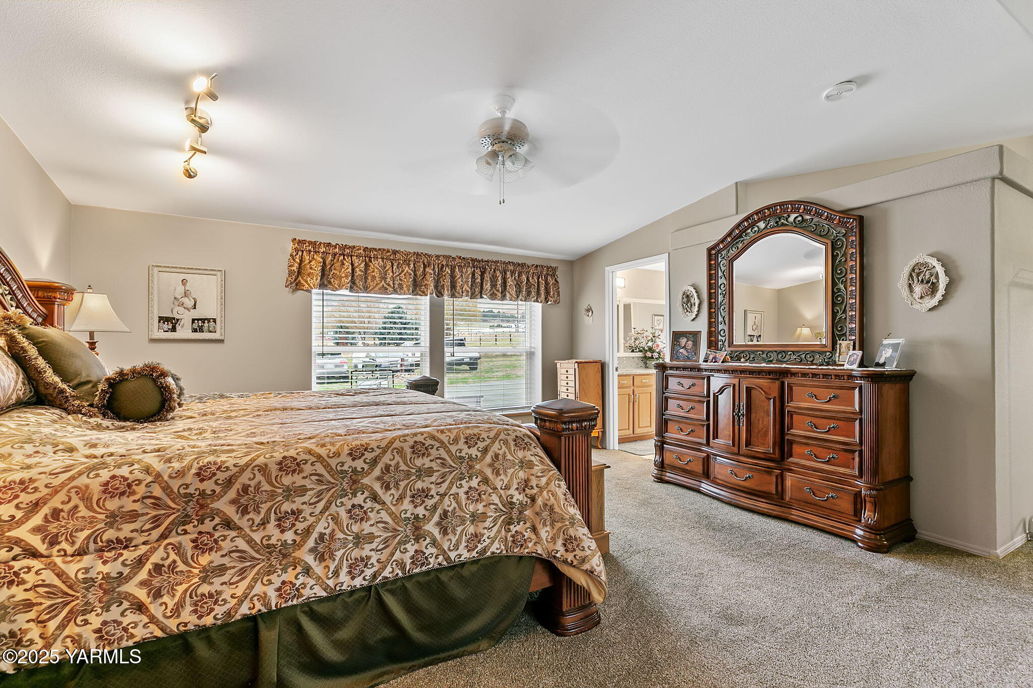 312 Wendt Road Yakima, WA 98901 - Photo 15 of 37 a bedroom with a bed and dresser with mirror