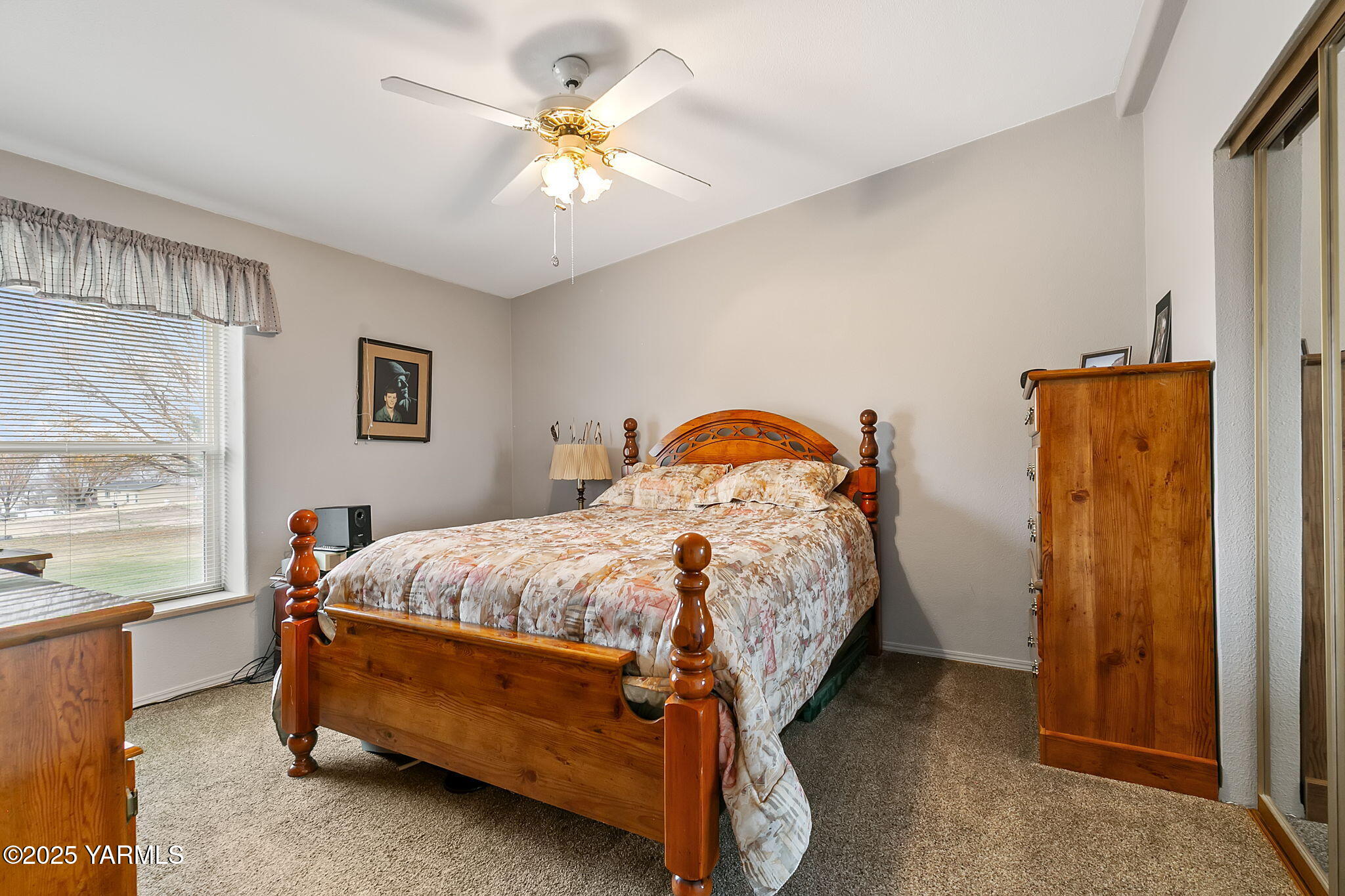 312 Wendt Road Yakima, WA 98901 - Photo 19 of 37 a bedroom with a bed and a chandelier