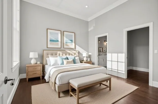 a bedroom with a bed and a table