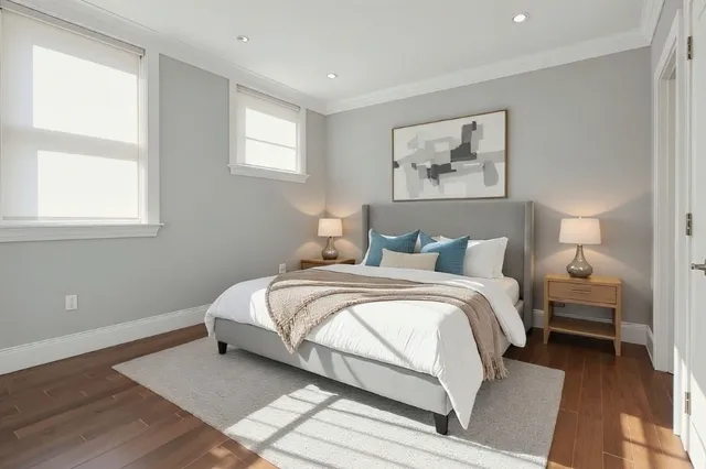 a bedroom with bed and a window