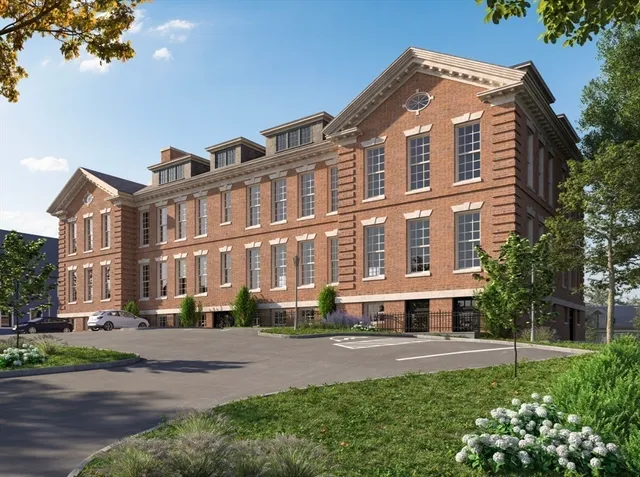 a front view of building with yard