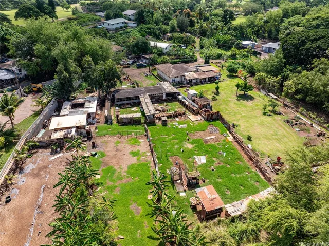 an aerial view of residential houses with outdoor space