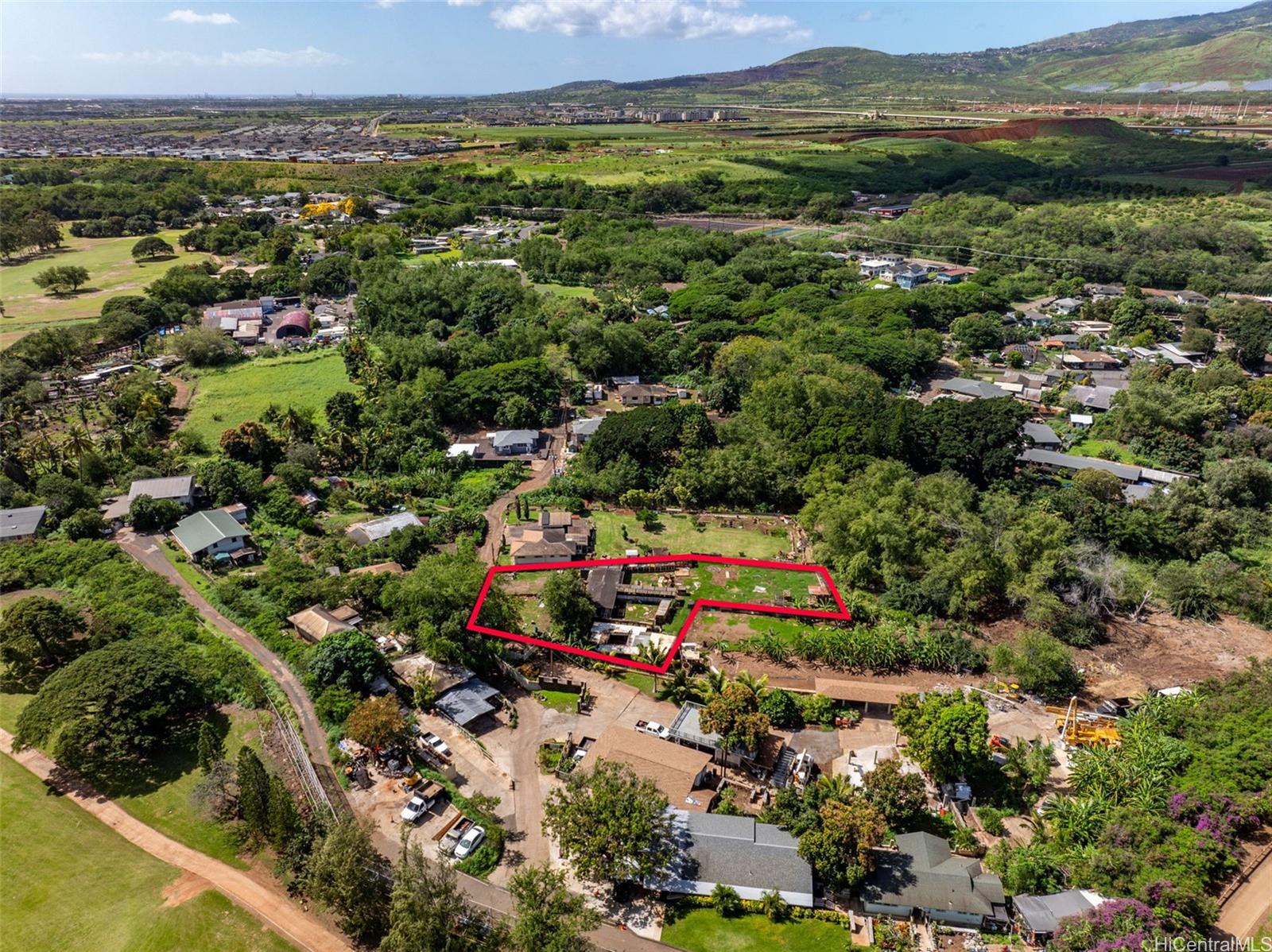 91-2133 Fort Weaver Road Ewa Beach, HI 96706 - Photo 18 of 23 an aerial view of residential houses with outdoor space and trees