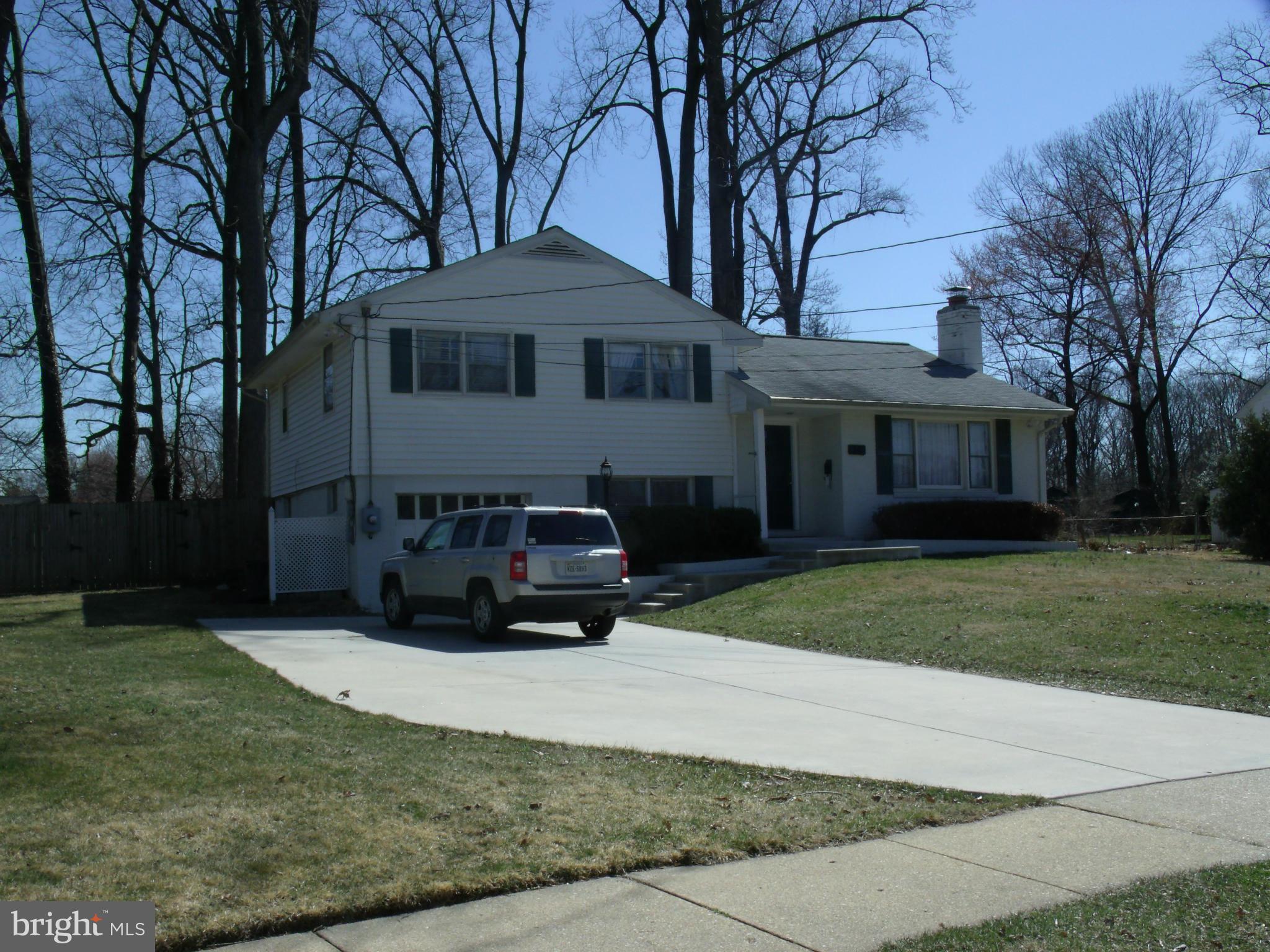 5214 Light Street Springfield, VA 22151 - Photo 2 of 27 a house view with a garden space