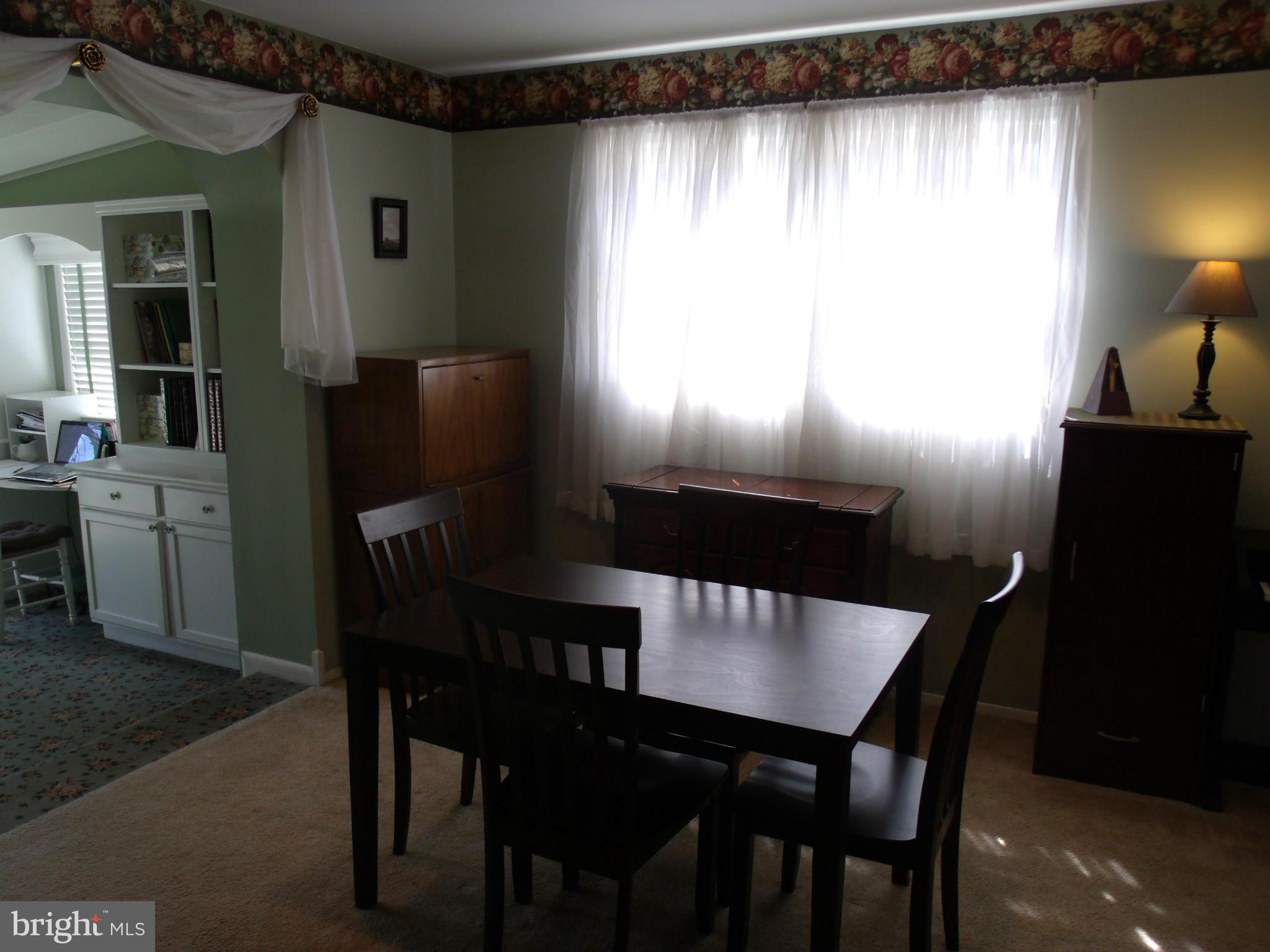 5214 Light Street Springfield, VA 22151 - Photo 14 of 27 a view of a dining room with furniture and window