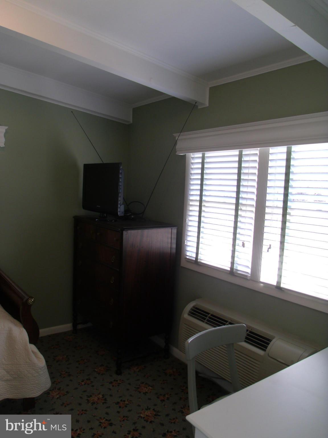 5214 Light Street Springfield, VA 22151 - Photo 16 of 27 a kitchen with a window and cabinets