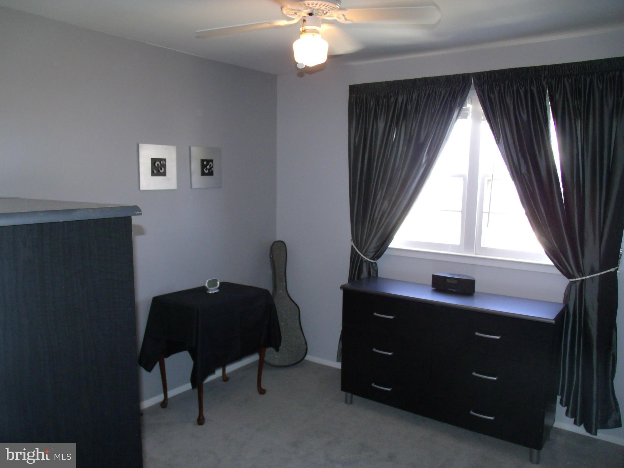 5214 Light Street Springfield, VA 22151 - Photo 18 of 27 a bedroom with a bed and a window