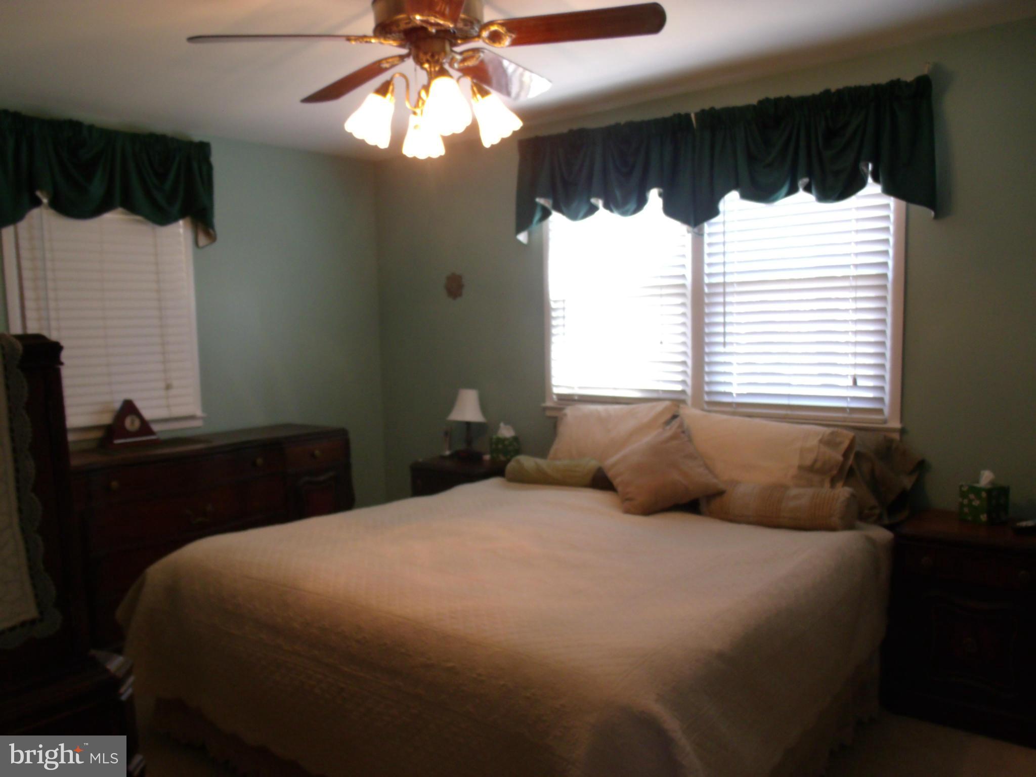 5214 Light Street Springfield, VA 22151 - Photo 19 of 27 a bedroom with a large bed and a window