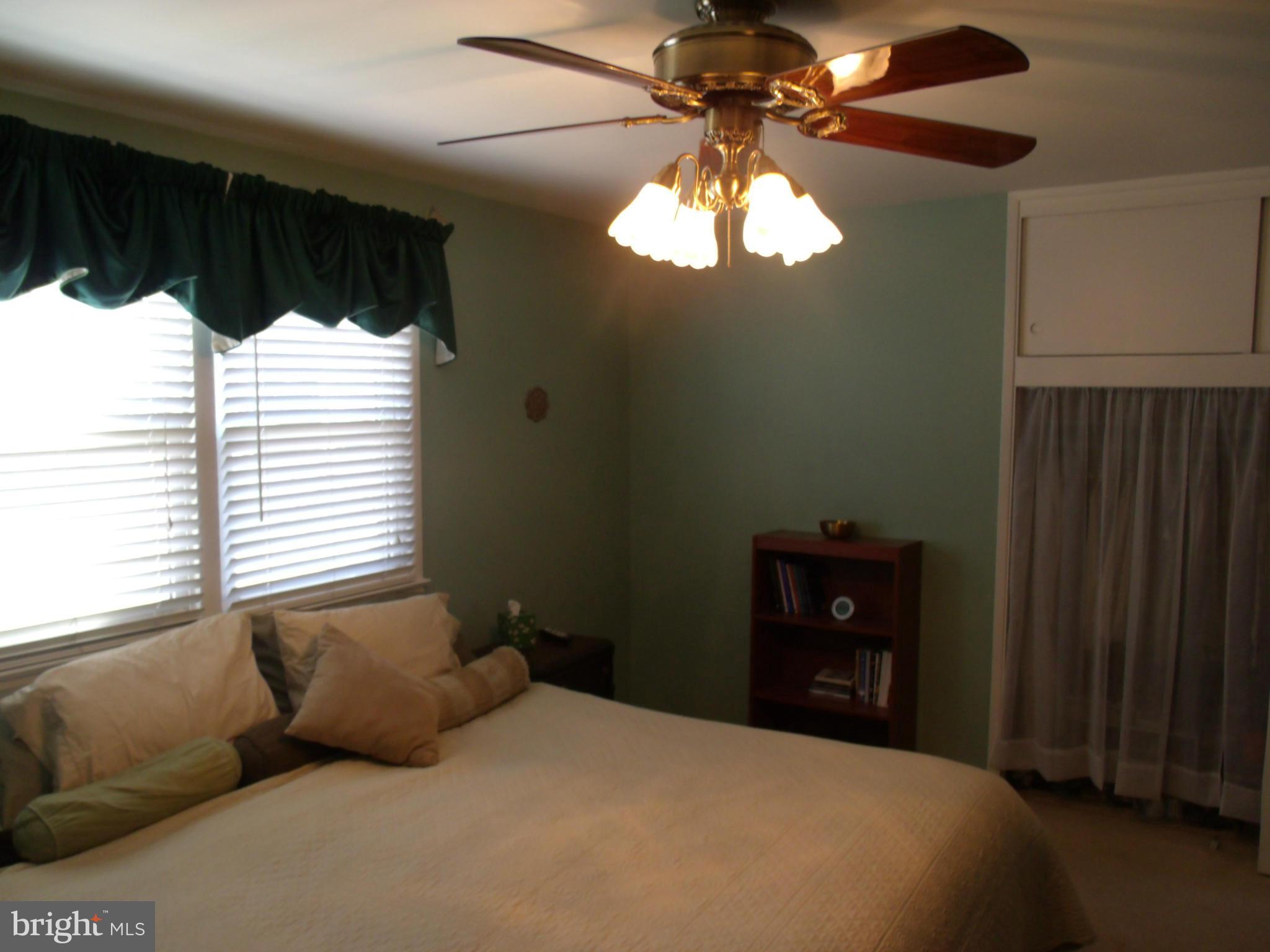 5214 Light Street Springfield, VA 22151 - Photo 20 of 27 a bedroom with a bed and a window