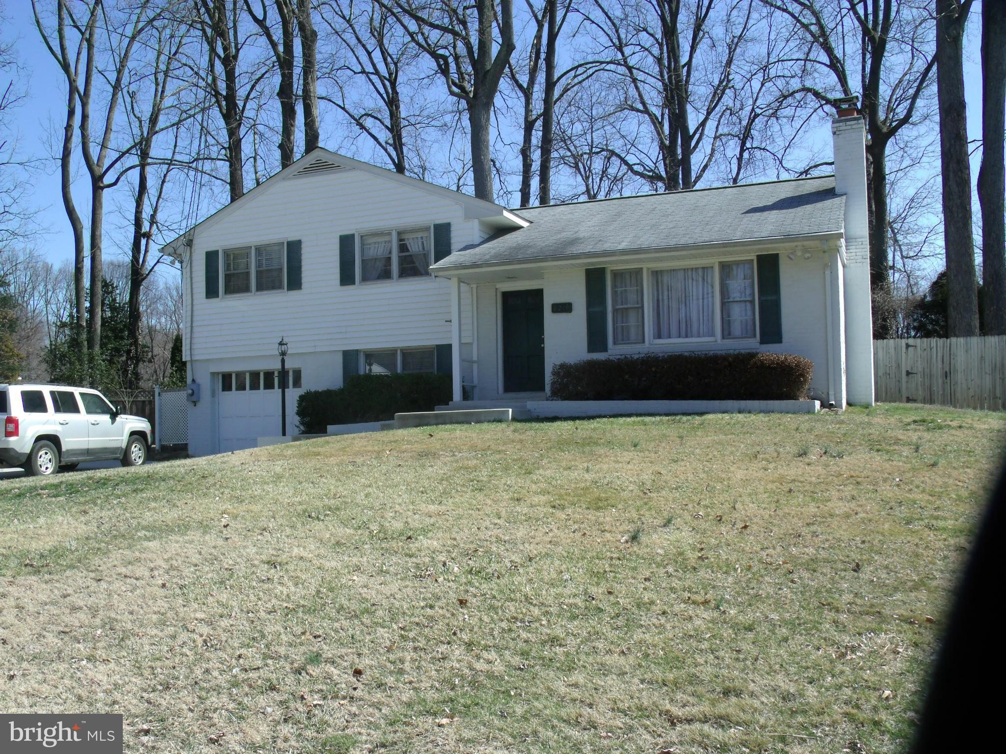 5214 Light Street Springfield, VA 22151 - Photo 3 of 27 a front view of a house with a yard
