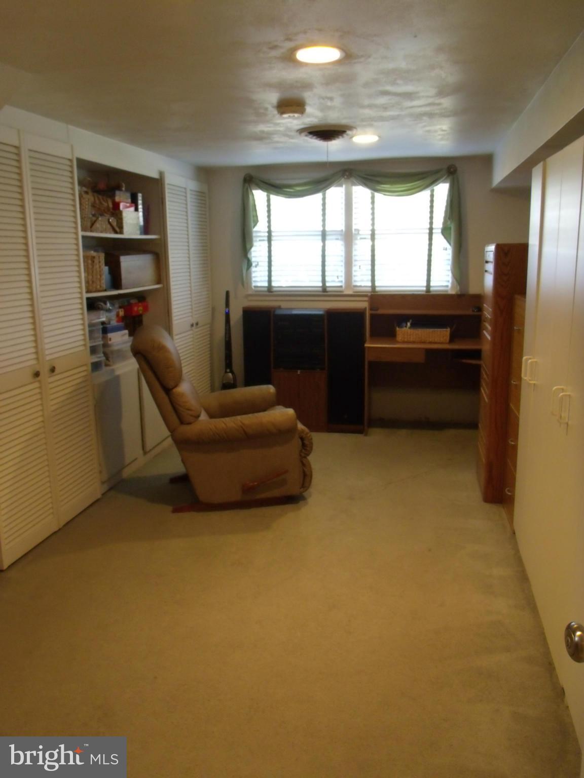 5214 Light Street Springfield, VA 22151 - Photo 21 of 27 a living room with a couch and a table