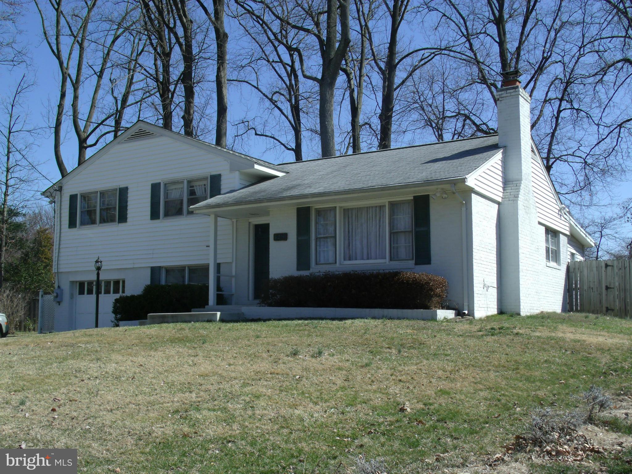 5214 Light Street Springfield, VA 22151 - Photo 4 of 27 a front view of a house with a yard