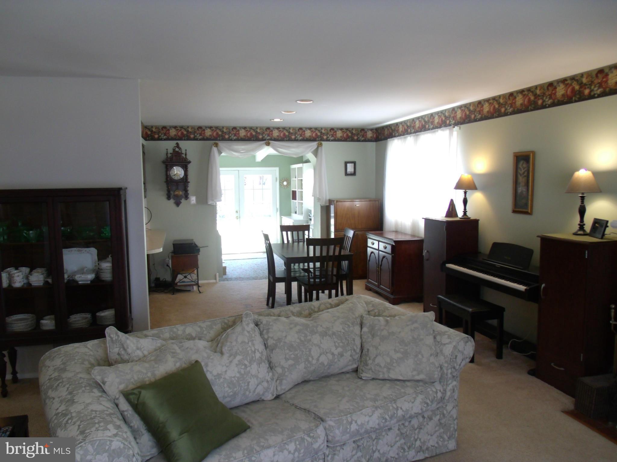 5214 Light Street Springfield, VA 22151 - Photo 9 of 27 a living room with furniture and a piano