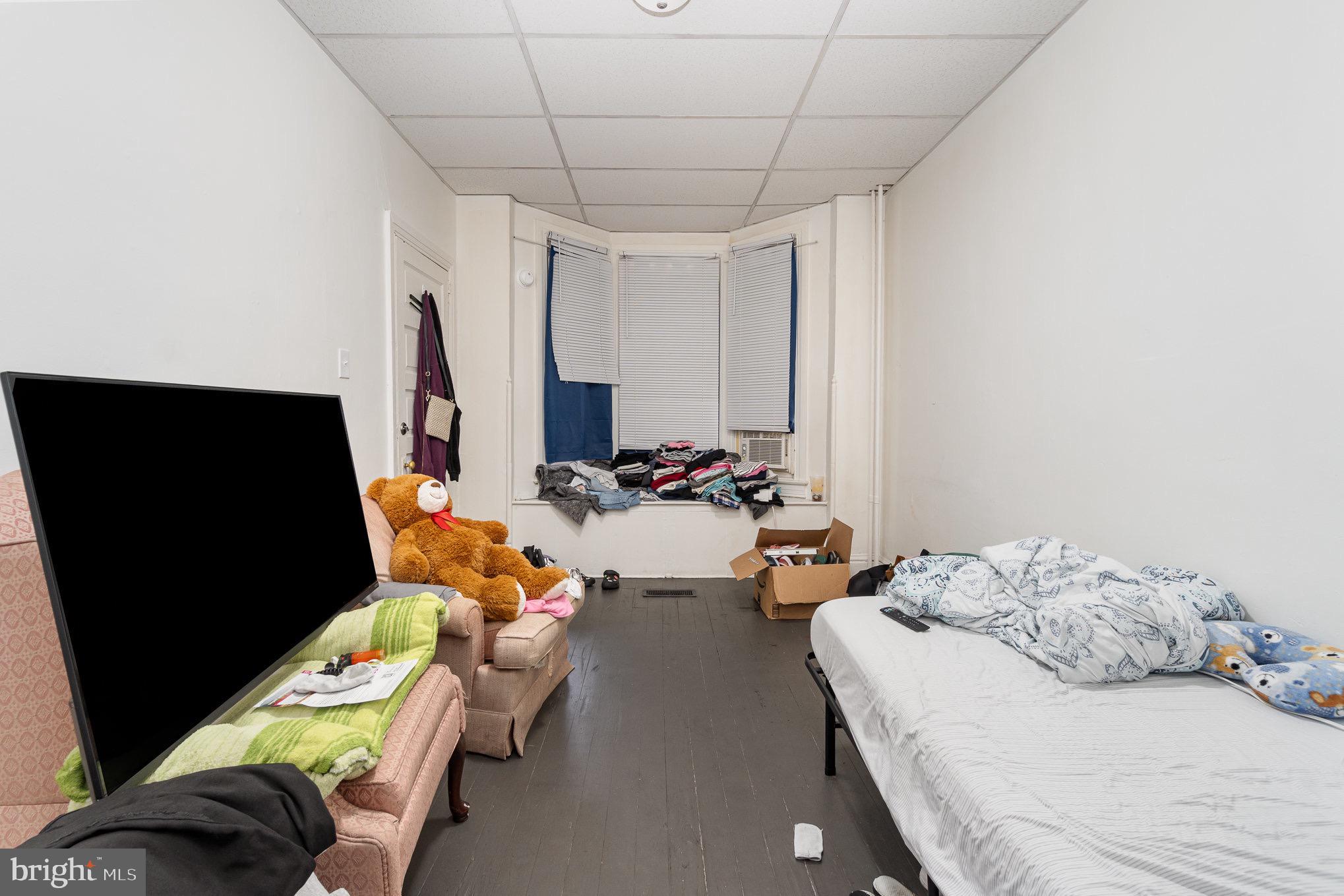 281 West Cottage Place York, PA 17401 - Photo 17 of 30 a bedroom with bed and a flat screen tv