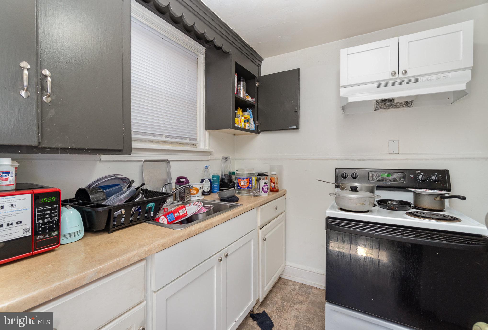 281 West Cottage Place York, PA 17401 - Photo 23 of 30 a kitchen with stainless steel appliances granite countertop a sink dishwasher stove and cabinets