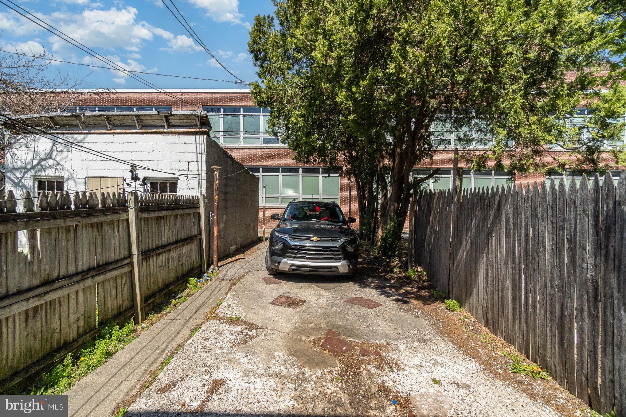 281 West Cottage Place York, PA 17401 - Photo 28 of 30 a car parked in front of a house with wooden fence