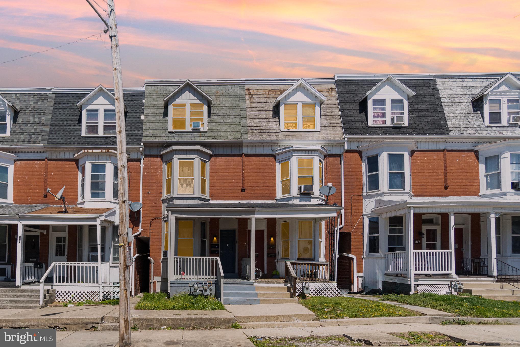 281 West Cottage Place York, PA 17401 - Photo 30 of 30 a front view of a residential apartment building with a yard