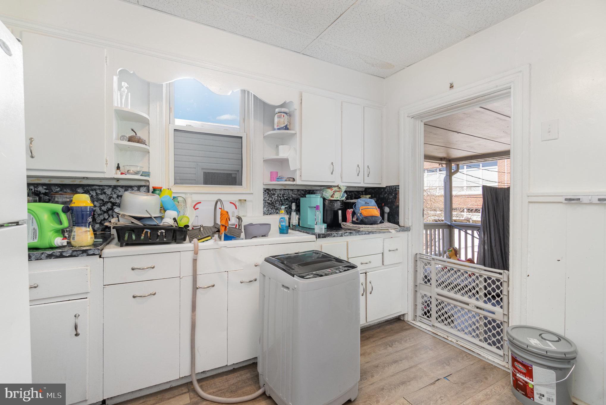 281 West Cottage Place York, PA 17401 - Photo 4 of 30 a kitchen with white cabinets and appliances